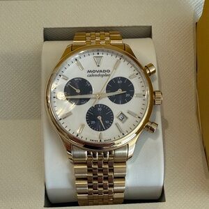 Movado Gold and White Chronograph Watch with Black Subdials. Movado calendoplan.